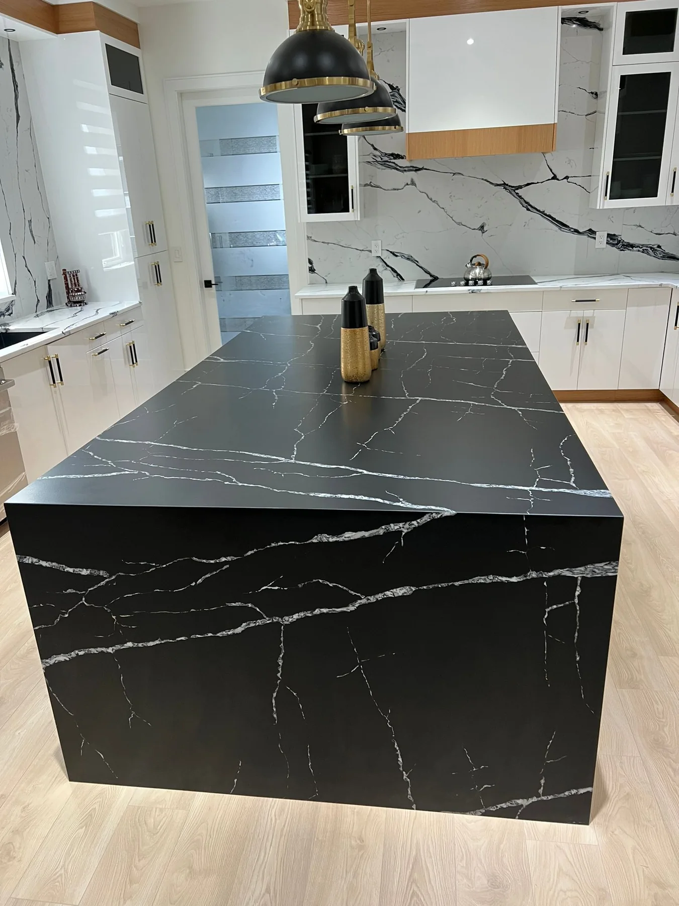 Dark stone kitchen countertop and island surfaces.