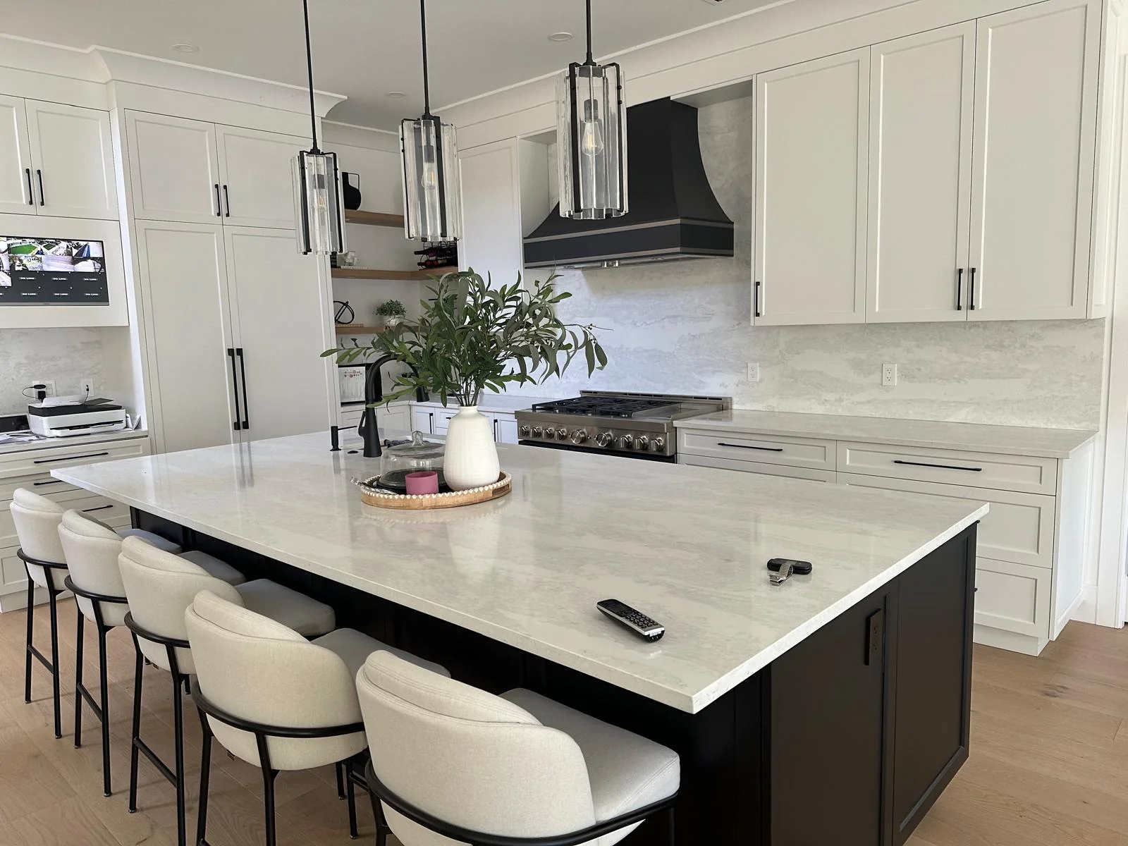 Family kitchen with large island and light countertop.