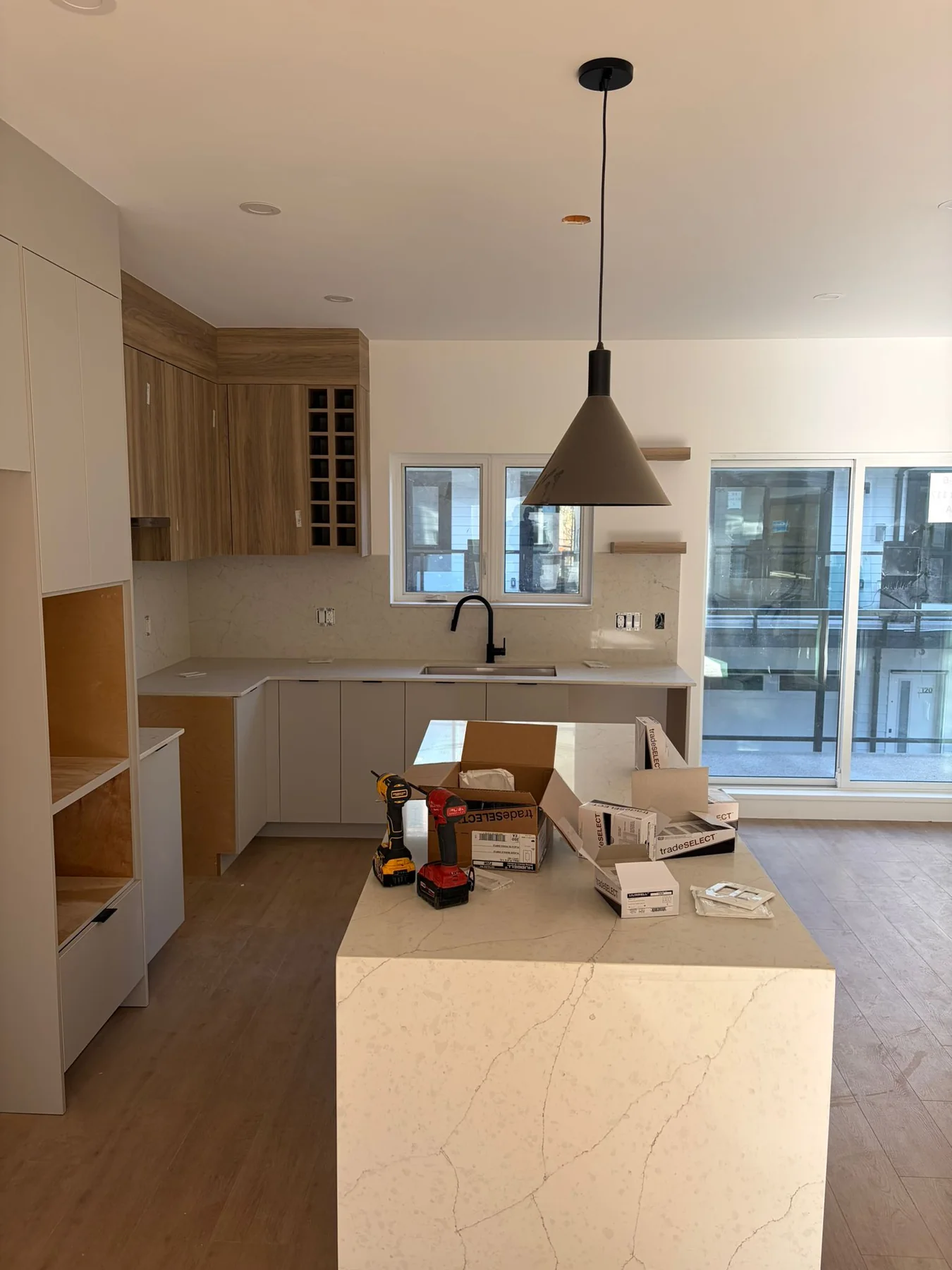 Open interior renovation with light countertop surface.