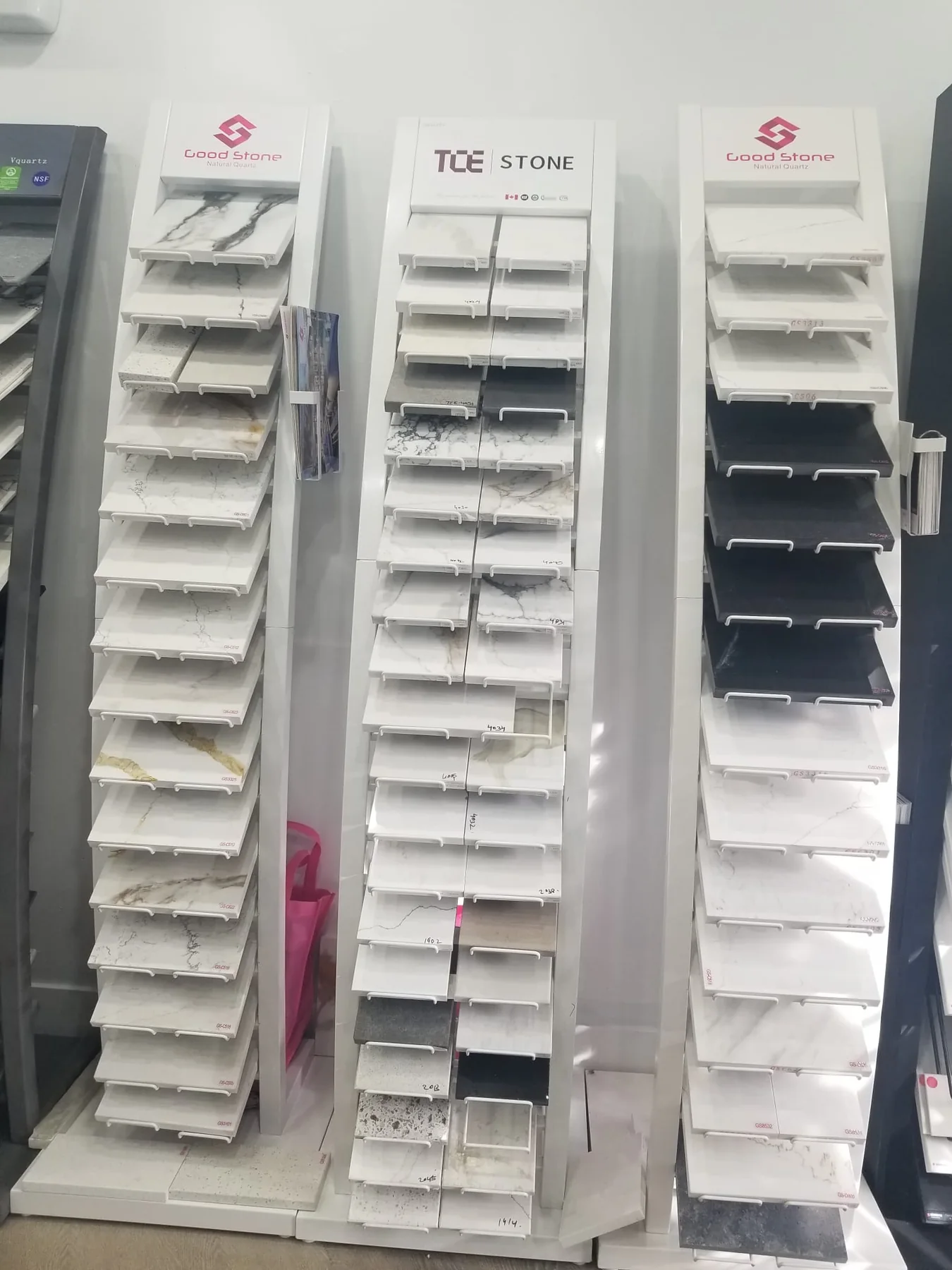 Stone surface sample display rack in a supplier showroom.