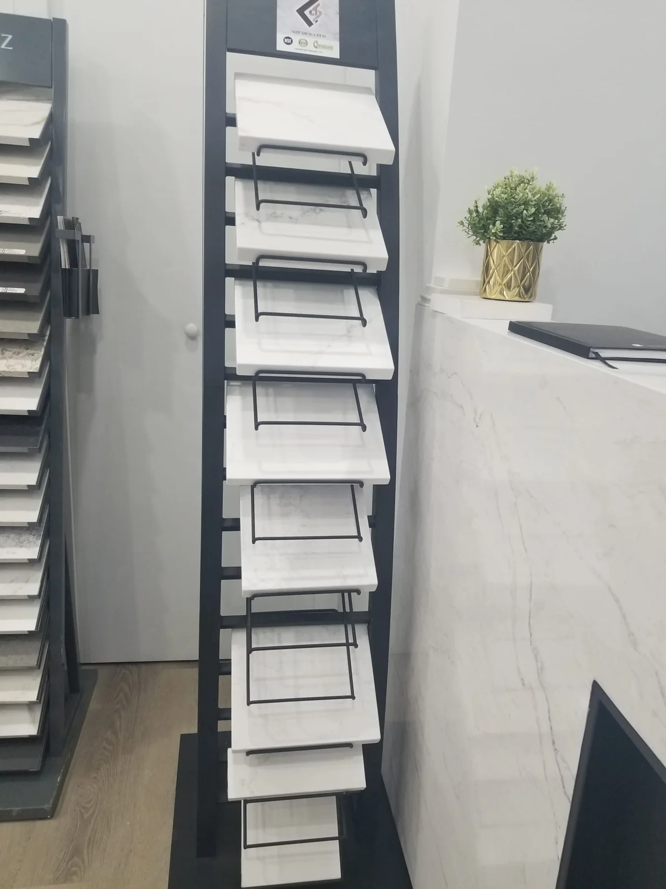Quartz and stone colour sample rack for countertop selection.